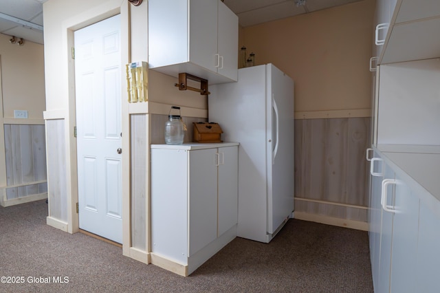 19 Meadow Rd, Hudson Falls, NY 12839 - kitchen featuring light colored carpet, freestanding refrigerator, white cabinets, and light countertops