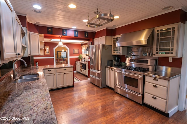 19 Meadow Rd, Hudson Falls, NY 12839 - kitchen featuring stainless steel countertops, appliances with stainless steel finishes, wall chimney exhaust hood, open shelves, and dark wood-style floors
