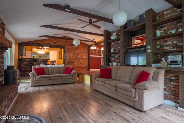 19 Meadow Rd, Hudson Falls, NY 12839 - living room with a chandelier, wood-type flooring, brick wall, and ceiling fan