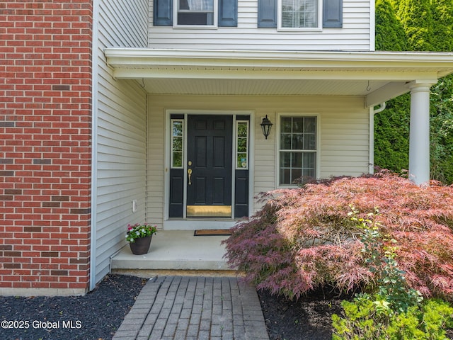 16 Callaway Cir, Colonie, NY 12211 - doorway to property with a porch and brick siding