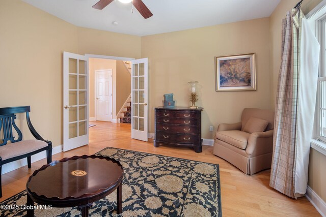 16 Callaway Cir, Colonie, NY 12211 - sitting room with french doors, light wood-type flooring, ceiling fan, and stairs
