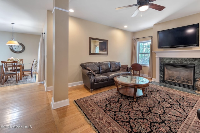 16 Callaway Cir, Colonie, NY 12211 - living room featuring light wood-type flooring, a ceiling fan, a high end fireplace, and recessed lighting