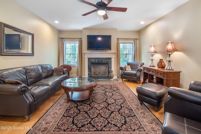 16 Callaway Cir, Colonie, NY 12211 - living room featuring a high end fireplace, a ceiling fan, plenty of natural light, light wood-style flooring, and recessed lighting
