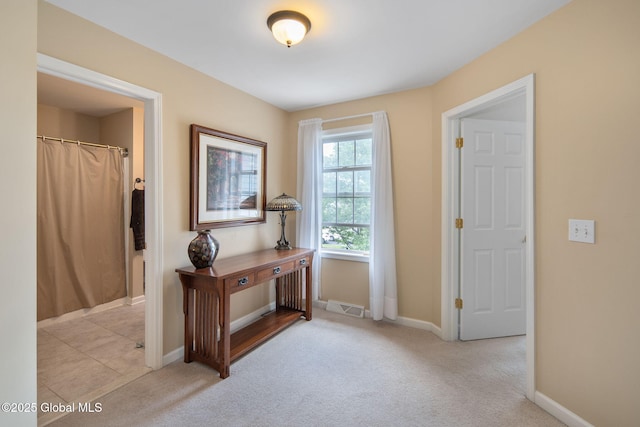 16 Callaway Cir, Colonie, NY 12211 - hallway featuring light carpet and baseboards