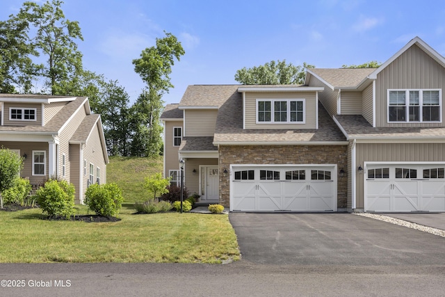 10A Idared Ln, Halfmoon, NY 12065 - view of front of house with a front yard, roof with shingles, a garage, and asphalt driveway