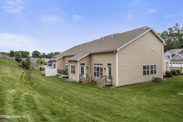 10A Idared Ln, Halfmoon, NY 12065 - back of house featuring a shingled roof and a lawn
