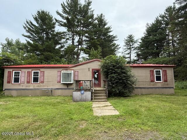 178 E High St, Malta, NY 12020 - manufactured / mobile home featuring a front lawn