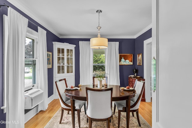 1101 Ardsley Rd, Schenectady, NY 12308 - dining area with plenty of natural light, light wood finished floors, ornamental molding, and cooling unit