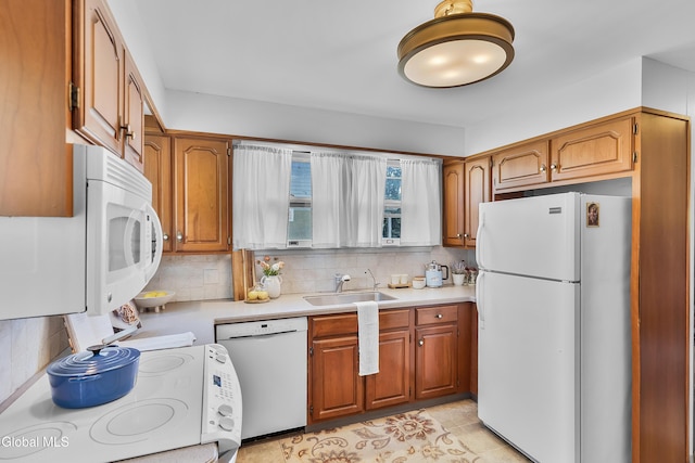 1101 Ardsley Rd, Schenectady, NY 12308 - kitchen with white appliances, light countertops, backsplash, and brown cabinets