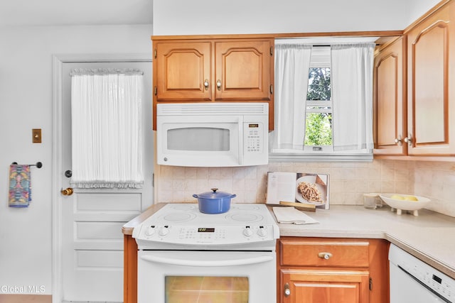 1101 Ardsley Rd, Schenectady, NY 12308 - kitchen featuring white appliances, light countertops, and tasteful backsplash