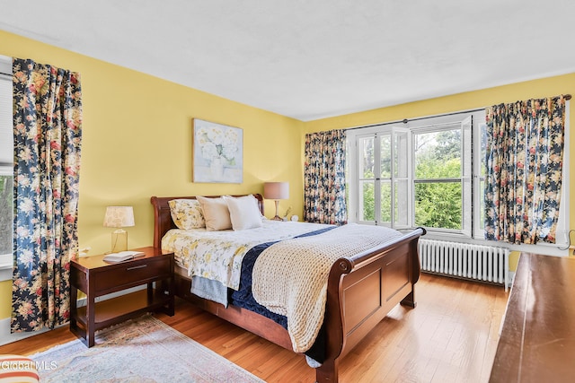 1101 Ardsley Rd, Schenectady, NY 12308 - bedroom with radiator heating unit and wood finished floors
