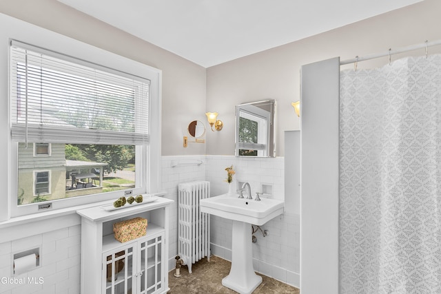 1101 Ardsley Rd, Schenectady, NY 12308 - full bath with radiator heating unit, tile walls, wainscoting, and curtained shower