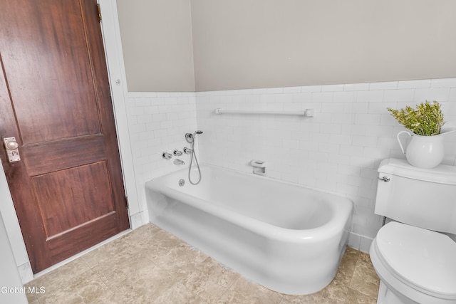 1101 Ardsley Rd, Schenectady, NY 12308 - full bathroom featuring a garden tub, tile walls, pet washing station, and a wainscoted wall