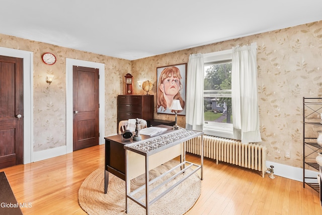 1101 Ardsley Rd, Schenectady, NY 12308 - office with radiator, wallpapered walls, and wood-type flooring