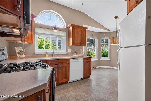 13 Hyland Cir, Troy, NY 12182 - kitchen with white appliances, brown cabinetry, plenty of natural light, lofted ceiling, and decorative light fixtures