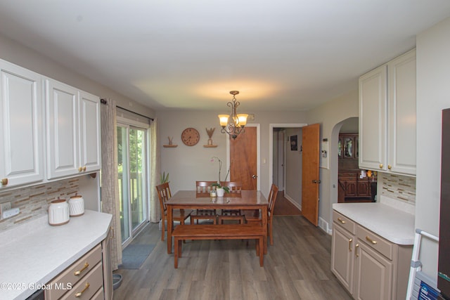 33 Woodside Dr, Glenville, NY 12302 - dining space with arched walkways, a chandelier, and light wood finished floors