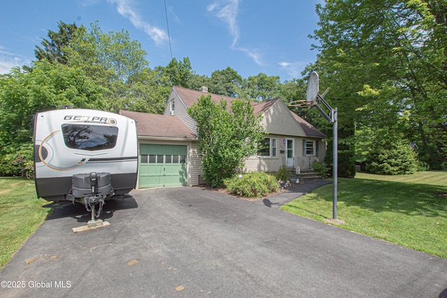 33 Woodside Dr, Glenville, NY 12302 - view of front of home featuring a garage, a front lawn, asphalt driveway, a chimney, and roof with shingles