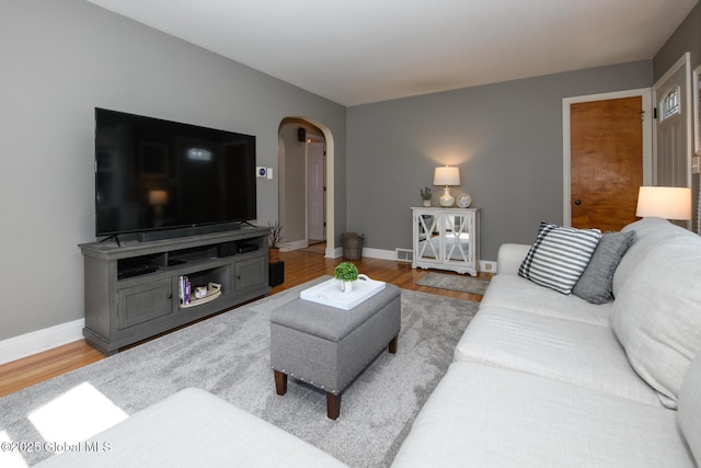 23 Mcmillen Pl, Bethlehem, NY 12054 - living room with arched walkways and wood finished floors