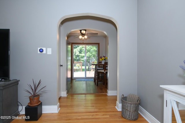 23 Mcmillen Pl, Bethlehem, NY 12054 - corridor featuring arched walkways and light wood finished floors