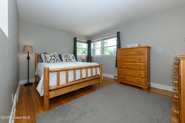23 Mcmillen Pl, Bethlehem, NY 12054 - bedroom with baseboards and wood finished floors