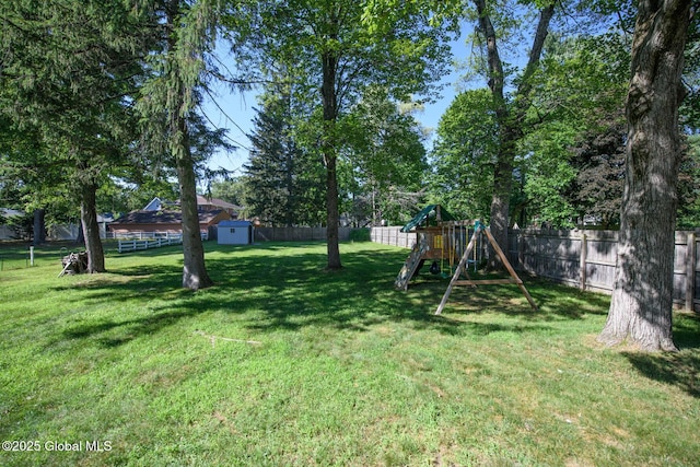23 Mcmillen Pl, Bethlehem, NY 12054 - fenced backyard with a playground and a shed