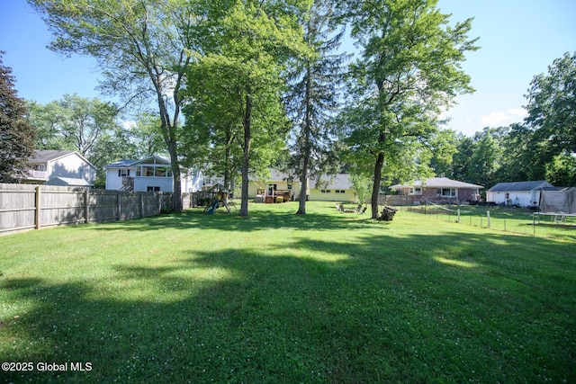 23 Mcmillen Pl, Bethlehem, NY 12054 - fenced backyard with a trampoline and a residential view
