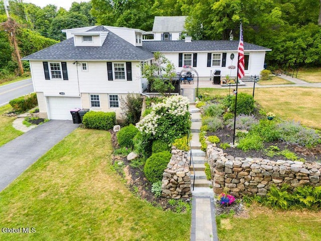 1264 Pilot Knob Rd, Fort Ann, NY 12844 - view of front of house featuring roof with shingles, a front yard, a garage, and driveway