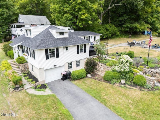 1264 Pilot Knob Rd, Fort Ann, NY 12844 - view of front of property featuring roof with shingles, an attached garage, asphalt driveway, and a front yard