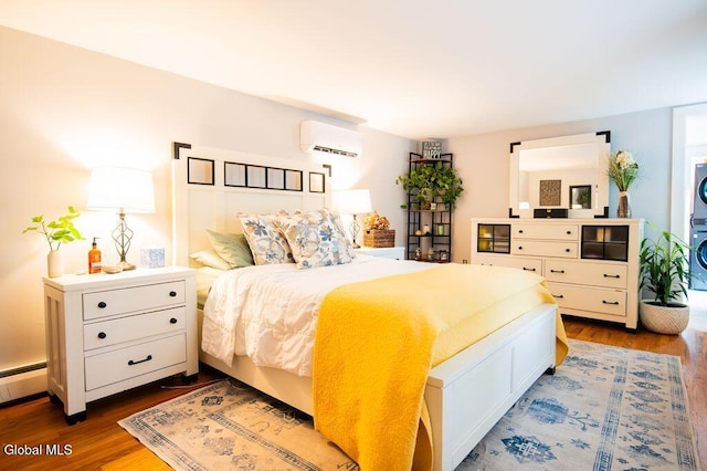 1264 Pilot Knob Rd, Fort Ann, NY 12844 - bedroom featuring a wall unit AC, dark wood-style flooring, and baseboard heating