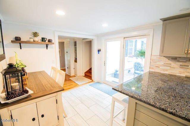 1264 Pilot Knob Rd, Fort Ann, NY 12844 - kitchen featuring ornamental molding, gray cabinetry, dark stone countertops, decorative backsplash, and open shelves