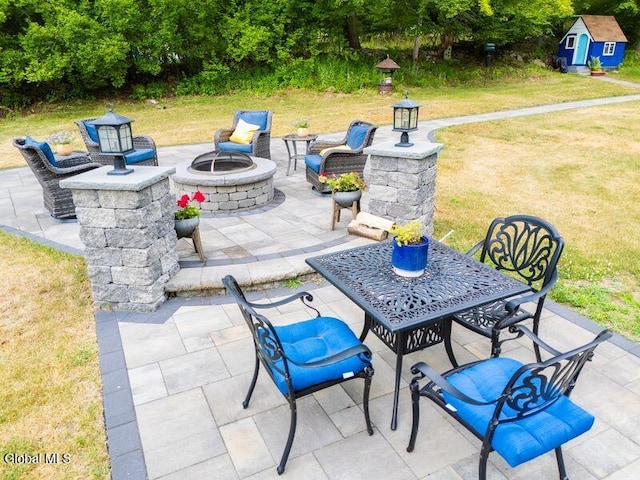 1264 Pilot Knob Rd, Fort Ann, NY 12844 - view of patio with a shed and an outdoor fire pit