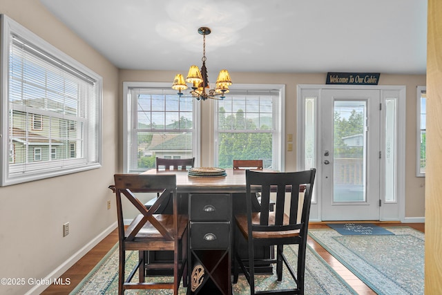 8 Latham Rd, Lake George, NY 12845 - dining space with a chandelier and wood finished floors