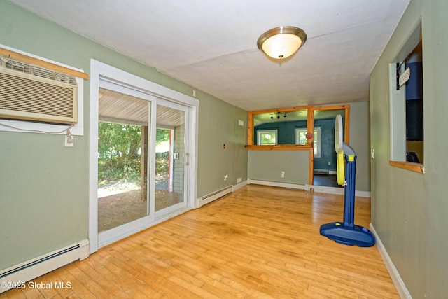 962 Camden Valley Rd, Salem, NY 12873 - unfurnished living room with baseboard heating, wood-type flooring, and a wall unit AC