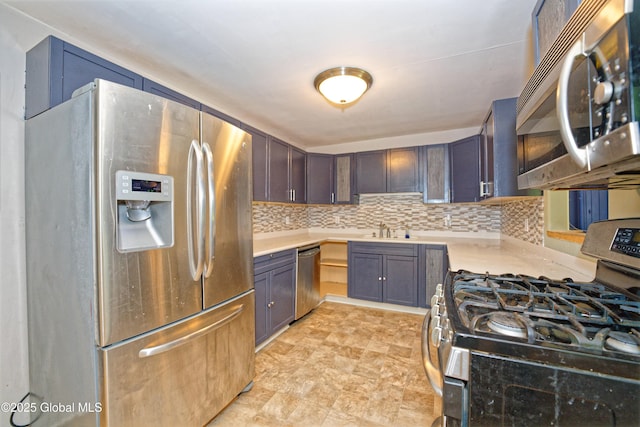 962 Camden Valley Rd, Salem, NY 12873 - kitchen with appliances with stainless steel finishes, light countertops, decorative backsplash, and stone finish flooring