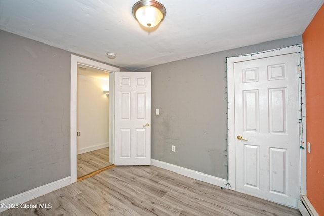 962 Camden Valley Rd, Salem, NY 12873 - unfurnished bedroom featuring wood finished floors and a baseboard radiator