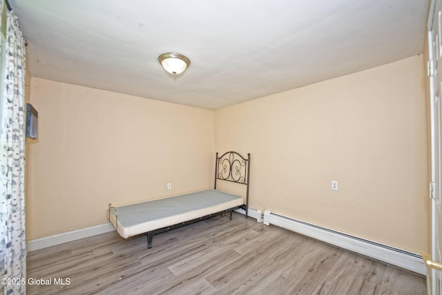 962 Camden Valley Rd, Salem, NY 12873 - unfurnished bedroom featuring a baseboard radiator and wood finished floors