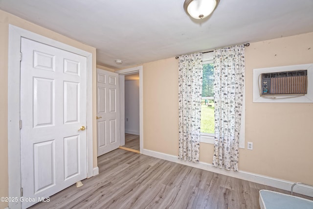 962 Camden Valley Rd, Salem, NY 12873 - empty room with wood finished floors, an AC wall unit, and a smoke detector