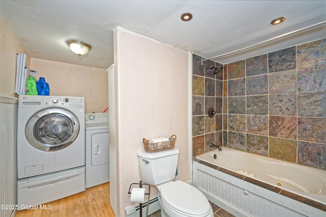 962 Camden Valley Rd, Salem, NY 12873 - bathroom with washer and clothes dryer, a combined bath / shower with jetted tub, wood finished floors, a baseboard heating unit, and recessed lighting