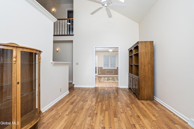 1 Maple Dr, Greenfield, NY 12833 - unfurnished living room with high vaulted ceiling, a ceiling fan, and wood finished floors
