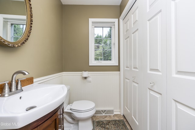 1 Maple Dr, Greenfield, NY 12833 - half bath featuring a wainscoted wall, vanity, and a closet