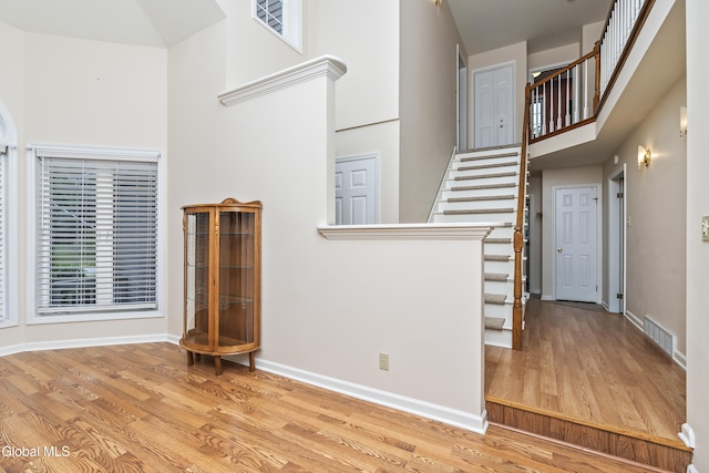 1 Maple Dr, Greenfield, NY 12833 - entrance foyer featuring wood finished floors, stairs, and a high ceiling