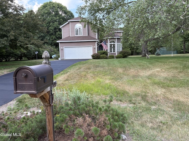 1 Maple Dr, Greenfield, NY 12833 - view of front of house with a garage, asphalt driveway, and a front yard
