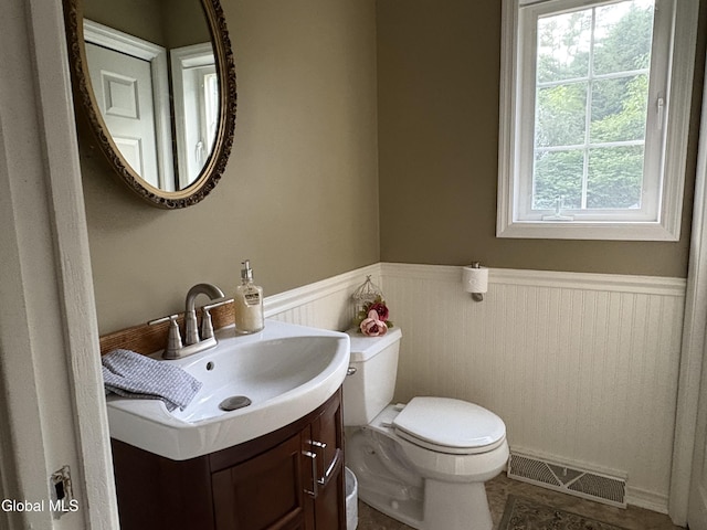 1 Maple Dr, Greenfield, NY 12833 - half bathroom featuring a wainscoted wall, plenty of natural light, and vanity