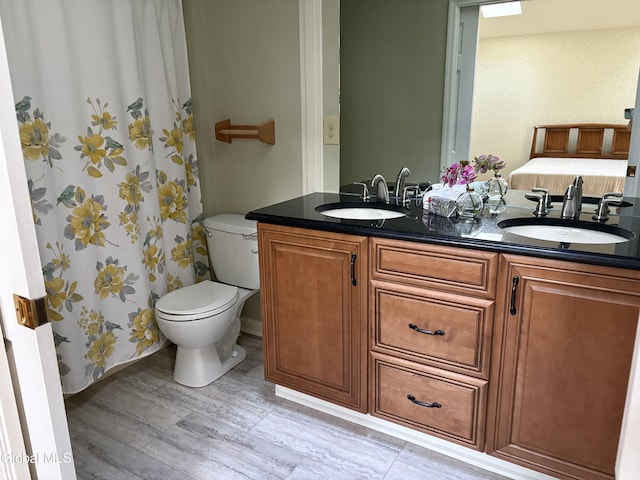 1 Maple Dr, Greenfield, NY 12833 - bathroom featuring double vanity, wood finished floors, and wallpapered walls