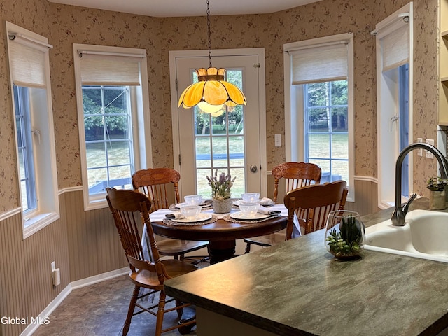 1 Maple Dr, Greenfield, NY 12833 - dining area featuring wallpapered walls, healthy amount of natural light, and a wainscoted wall