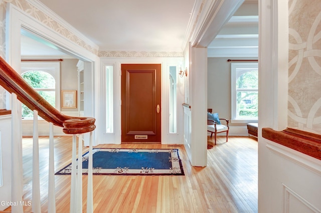 1171 Lowell Rd, Schenectady, NY 12308 - foyer featuring light wood-type flooring, ornamental molding, and wallpapered walls