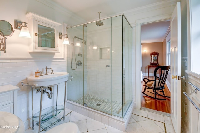 1171 Lowell Rd, Schenectady, NY 12308 - bathroom featuring crown molding, tile patterned flooring, a stall shower, and tile walls