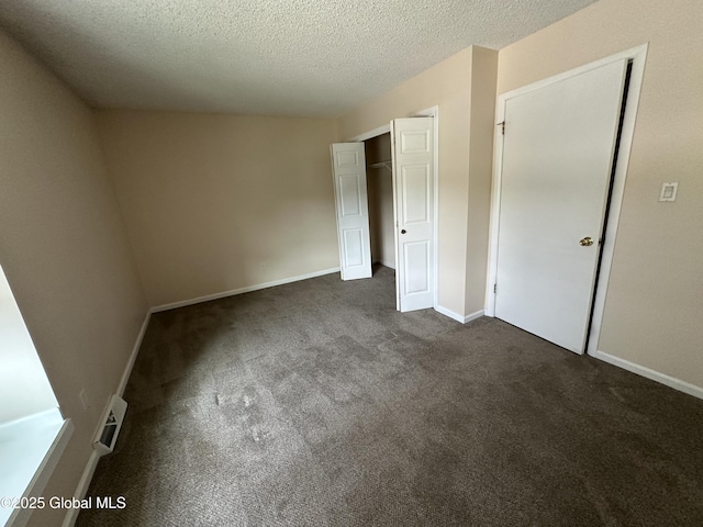 11 Derby Dr, Saratoga Springs, NY 12866 - unfurnished bedroom with dark colored carpet, a closet, and a textured ceiling