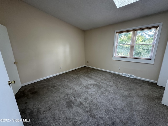 11 Derby Dr, Saratoga Springs, NY 12866 - unfurnished room with carpet floors, a skylight, and a textured ceiling