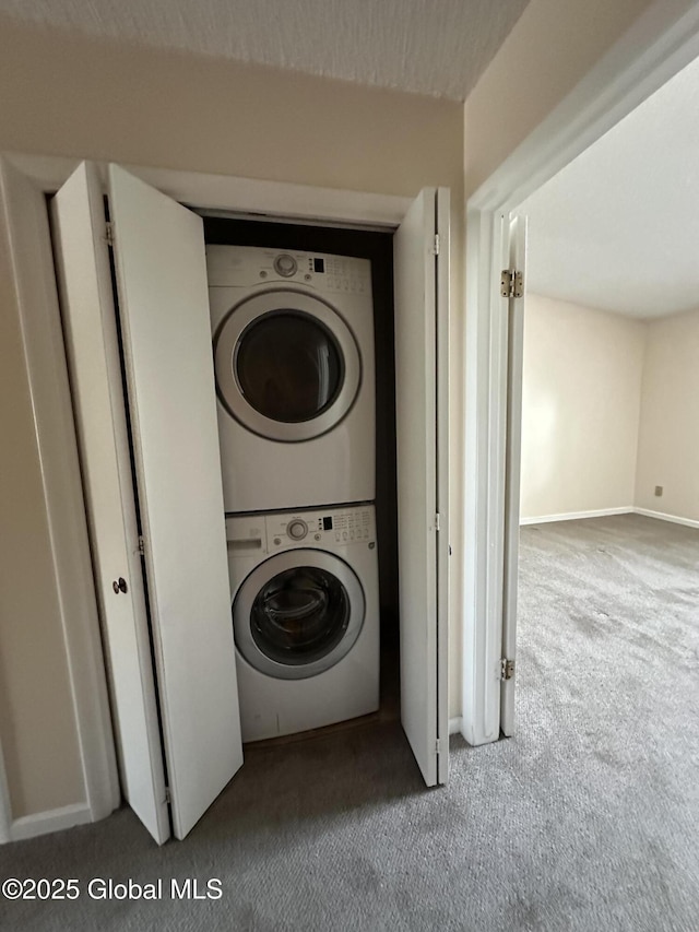 11 Derby Dr, Saratoga Springs, NY 12866 - laundry room featuring stacked washer and clothes dryer and carpet floors